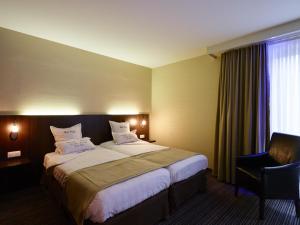 Postel nebo postele na pokoji v ubytování Hotel Europe