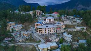 an aerial view of a village in the mountains at Canari Hotel kashmir view in Nathia Gali