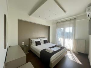 Un pat sau paturi într-o cameră la EPaN Luxury Apartments