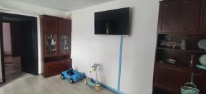 a toy car in a room with a refrigerator at Casa TE apartment in Orşova