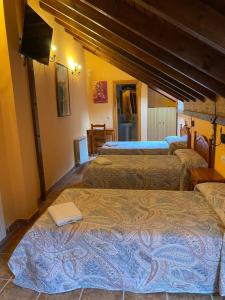 A bed or beds in a room at Casa Cuevas