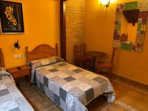 A bed or beds in a room at Casa Cuevas