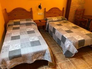A bed or beds in a room at Casa Cuevas