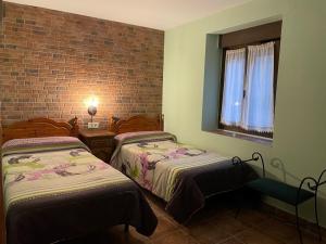 A bed or beds in a room at Casa Cuevas