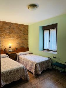 A bed or beds in a room at Casa Cuevas