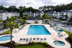 an aerial view of a pool at a resort at River Oaks Dr - 16F in Myrtle Beach