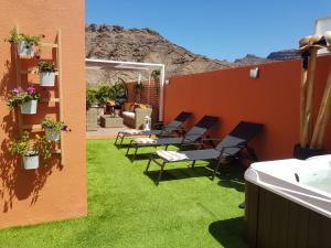 Fotografia z galérie ubytovania Fantástico ático con Jacuzzi y preciosa terraza v destinácii Puerto Rico de Gran Canaria