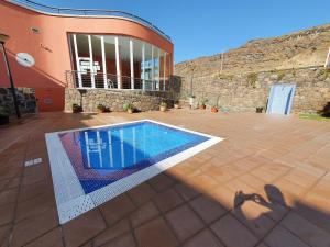 Fotografia z galérie ubytovania Fantástico ático con Jacuzzi y preciosa terraza v destinácii Puerto Rico de Gran Canaria