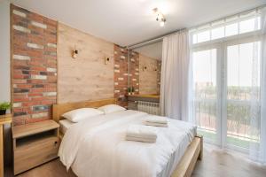 Posteľ alebo postele v izbe v ubytovaní Ochota Sunny Studio