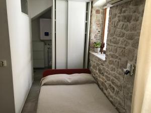Posteľ alebo postele v izbe v ubytovaní Figa Studio Apartman
