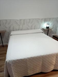 Postel nebo postele na pokoji v ubytování Ángeles home