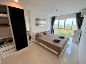 Postel nebo postele na pokoji v ubytování One Tower Condo Pattaya SeaView 86 + 15 fotografií