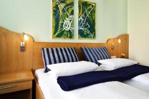 Ein Bett oder Betten in einem Zimmer der Unterkunft Gasthof Hotel Lang