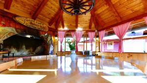a large room with a large clock on the ceiling at House Marinic in Grabovac