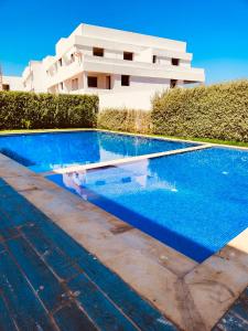 a swimming pool in front of a building at Luxury apartment 2 in Casablanca