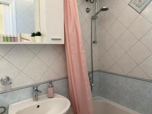 a bathroom with a sink and a shower at Apartmani Marko in Tučepi +35 photos