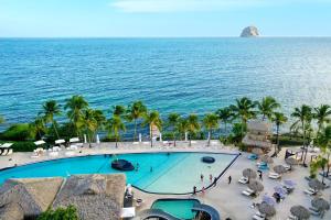 an overhead view of a swimming pool and the ocean at Diamond Paradise in Le Diamant