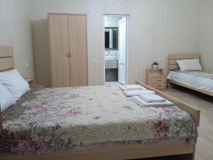 Voodi või voodid majutusasutuse Elegant Hotel toas