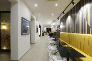 a row of tables and chairs in a restaurant at Best Western Hotel Martello in Lampedusa