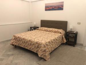 Postel nebo postele na pokoji v ubytování Hipponion Suite Red