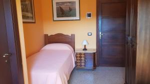 Postel nebo postele na pokoji v ubytování B&B A Robba de Pupi