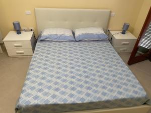 Postel nebo postele na pokoji v ubytování Residenza Punta Acquabella