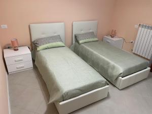 Postel nebo postele na pokoji v ubytování Residenza Punta Acquabella