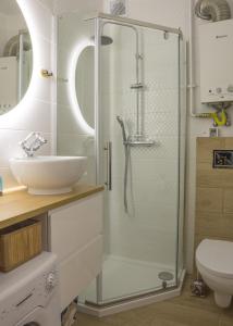 A bathroom at Complex Apartamenty - Morski