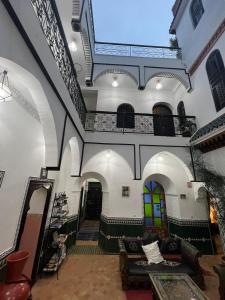 a living room with a staircase and a building at Riad Assalam in Marrakech