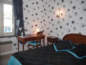 Postel nebo postele na pokoji v ubytování Hotel Le Clos du Montvinage