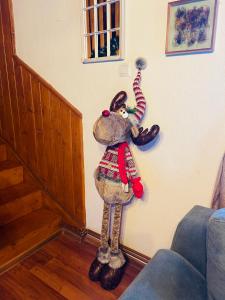 a stuffed animal is hanging on a wall at Casa Renilor in Azuga