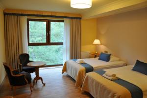 Łóżko lub łóżka w pokoju w obiekcie Hotel Mir-Jan SPA