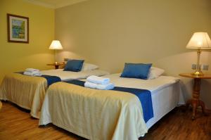 Łóżko lub łóżka w pokoju w obiekcie Hotel Mir-Jan SPA