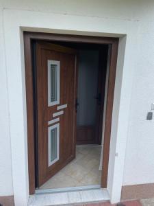 a wooden door in the side of a building at Porodicna kuca za odmor Kovaci in Zavidovići