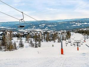 a ski lift on a ski slope in the snow at 11 person holiday home in Noresund-By Traum in Noresund +6 photos