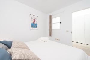 A bed or beds in a room at Casita tradicional canaria en Garachico - SanRoquito18