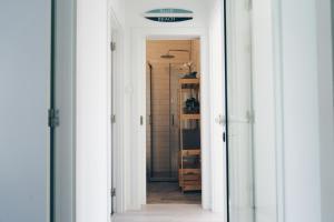 a hallway with a door leading into a room at Ferrel Village Home in Ferrel