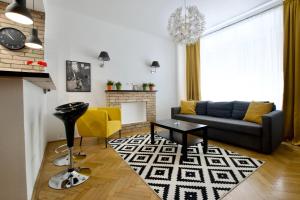 a living room with a couch and a table at Standard Apartment by Hi5 - Center of city center in Budapest
