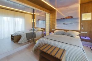 Un pat sau paturi într-o cameră la Lux Isla