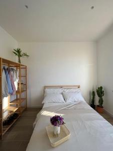 Un pat sau paturi într-o cameră la In-Experience