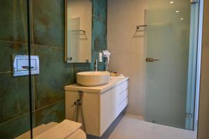 a bathroom with a sink and a shower at Levanta guesthouse in Schinoussa +18 photos