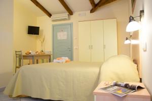 Postel nebo postele na pokoji v ubytování Minihotel IRIS