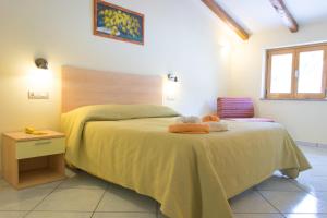 Postel nebo postele na pokoji v ubytování Minihotel IRIS