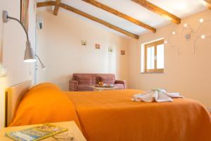 Postel nebo postele na pokoji v ubytování Minihotel IRIS