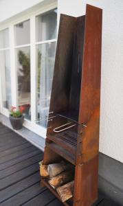 Gril dostupný pro hosty v apartmánu