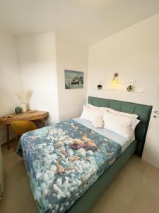 a bedroom with a bed with a blue blanket at Villa Sofia *Luxury experience in Calabria in Zambrone +61 photos