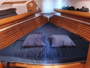 a bunk bed with two pillows on top of it at Voilier CALYPSO in La Rochelle