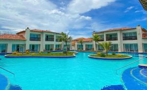 a view of a resort with blue water at Buzios Beach Resort Residencial super luxo 1307 in Búzios