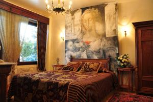 Postel nebo postele na pokoji v ubytování Leventis Art Suites