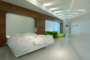 Letto o letti in una camera di i-Suite Hotel